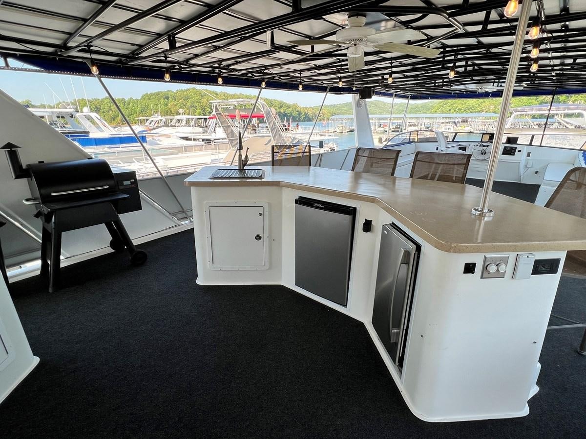 a room with a large table and chairs aboard 2010/1995 STARDUST 20 X 95WB NLST Yacht for Sale