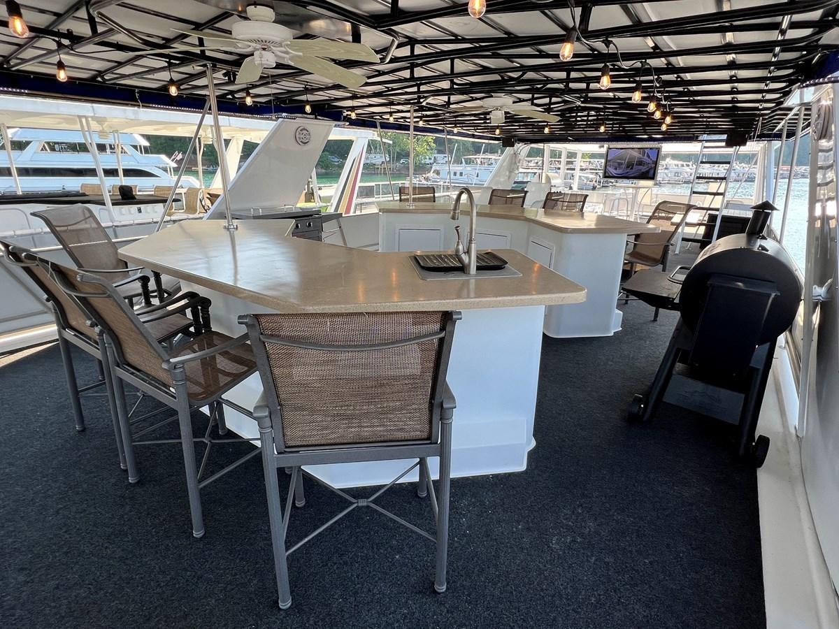 a room with tables and chairs aboard 2010/1995 STARDUST 20 X 95WB NLST Yacht for Sale