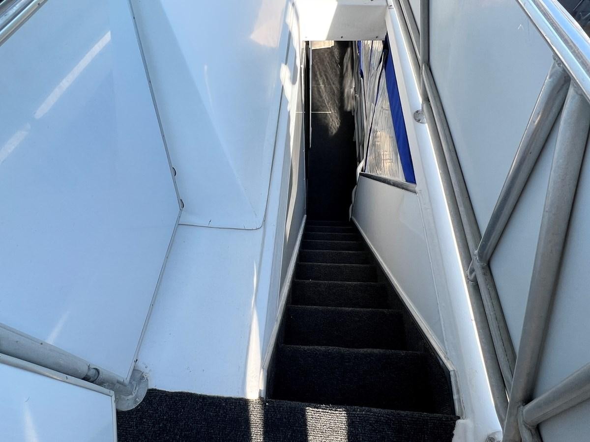 a black and white staircase aboard 2010/1995 STARDUST 20 X 95WB NLST Yacht for Sale