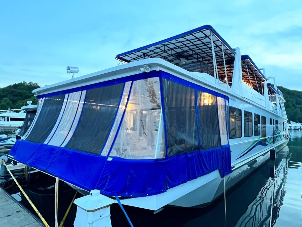 a boat with a blue roof aboard 2010/1995 STARDUST 20 X 95WB NLST Yacht for Sale