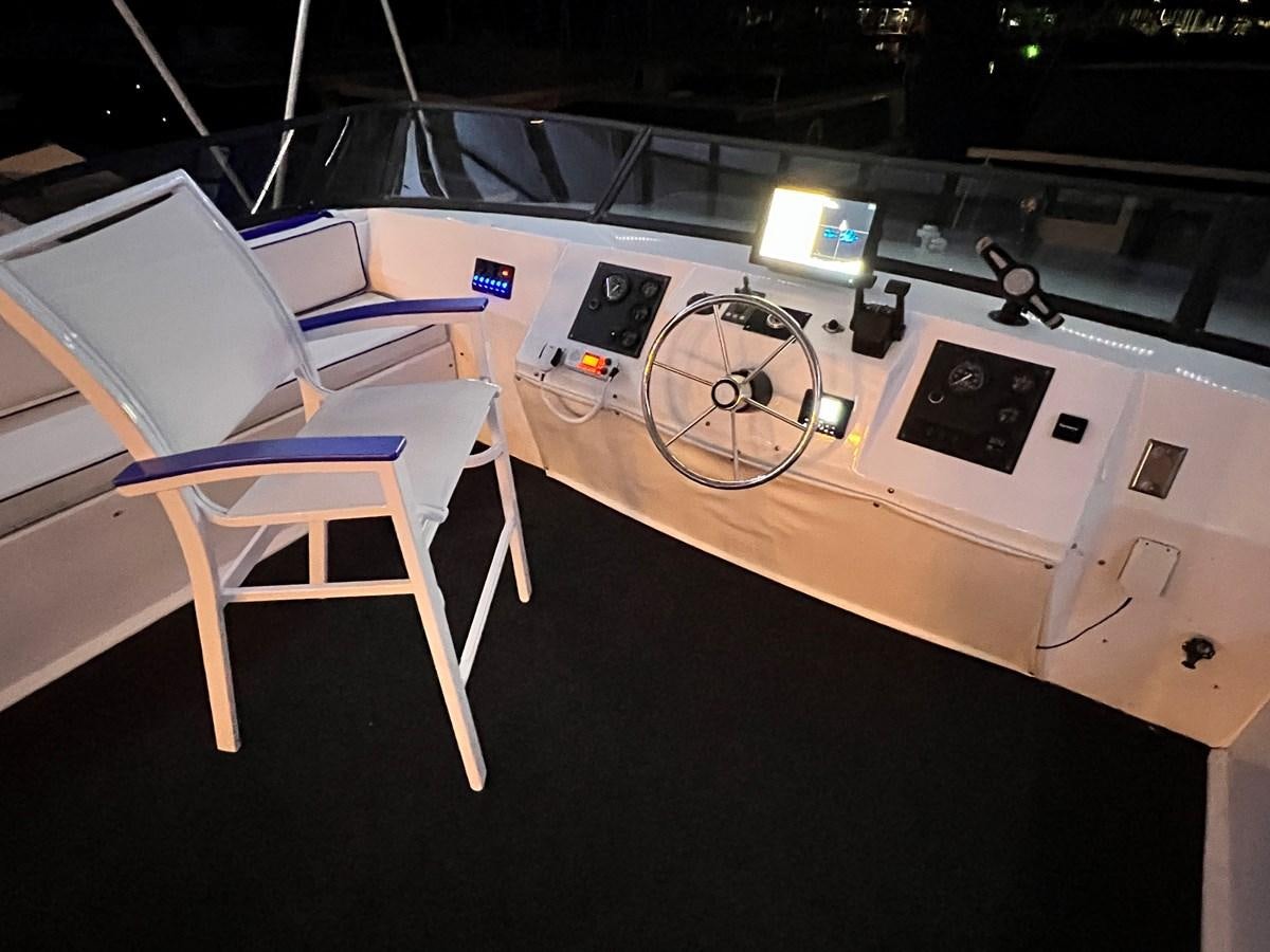 a room with a table and chairs aboard 2010/1995 STARDUST 20 X 95WB NLST Yacht for Sale