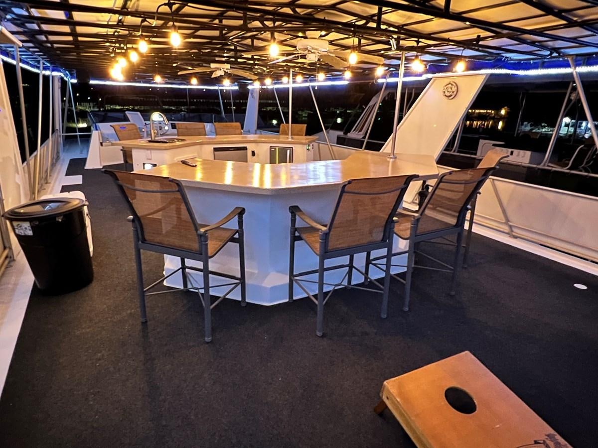 a large room with a table and chairs aboard 2010/1995 STARDUST 20 X 95WB NLST Yacht for Sale