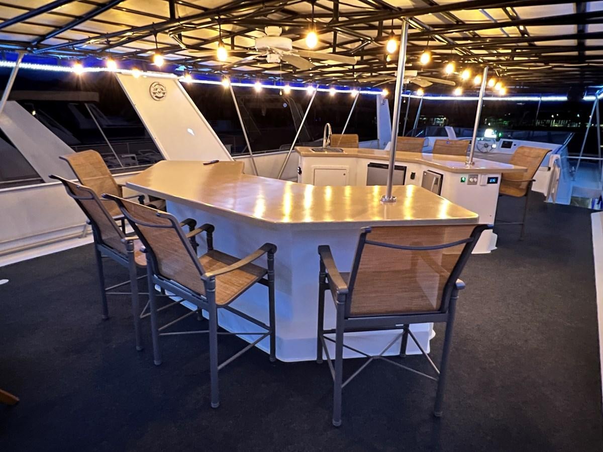 a large room with tables and chairs aboard 2010/1995 STARDUST 20 X 95WB NLST Yacht for Sale