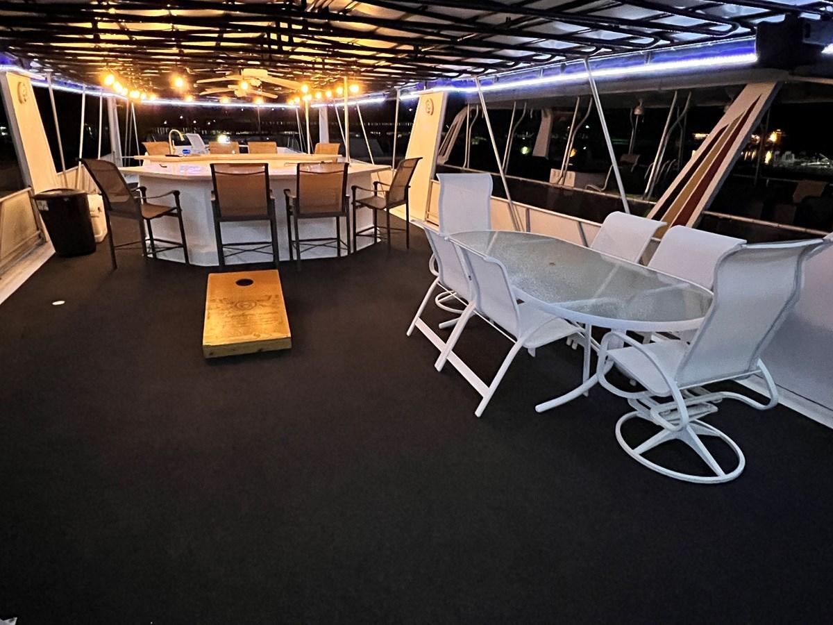 a room with chairs and tables aboard 2010/1995 STARDUST 20 X 95WB NLST Yacht for Sale