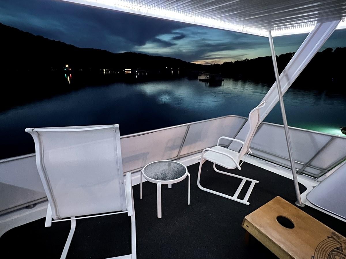 a room with a table and chairs aboard 2010/1995 STARDUST 20 X 95WB NLST Yacht for Sale