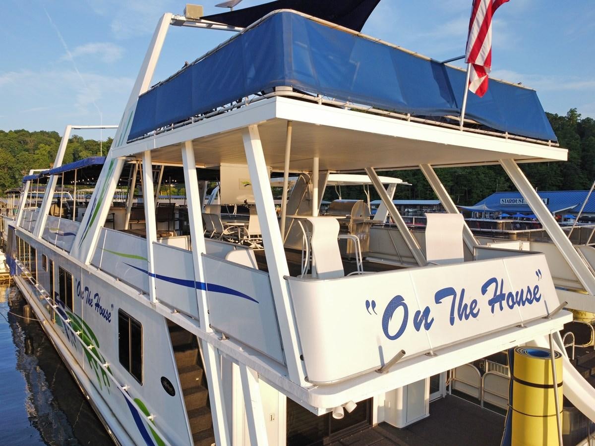 a boat with a flag on the side aboard 2010/1995 STARDUST 20 X 95WB NLST Yacht for Sale