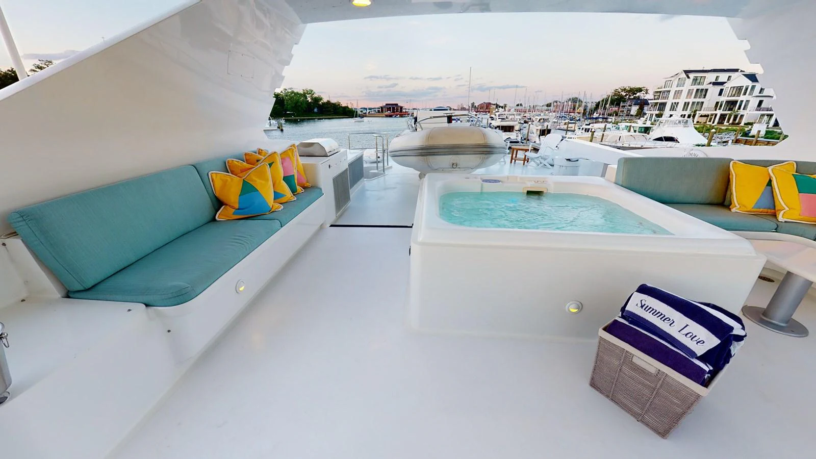 a pool with a lounge chair and a large building in the background aboard SUMMER LOVE Yacht for Sale