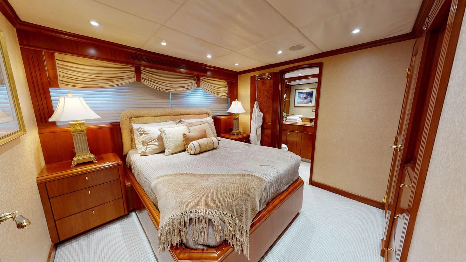a bedroom with a bed and a lamp aboard SUMMER LOVE Yacht for Sale