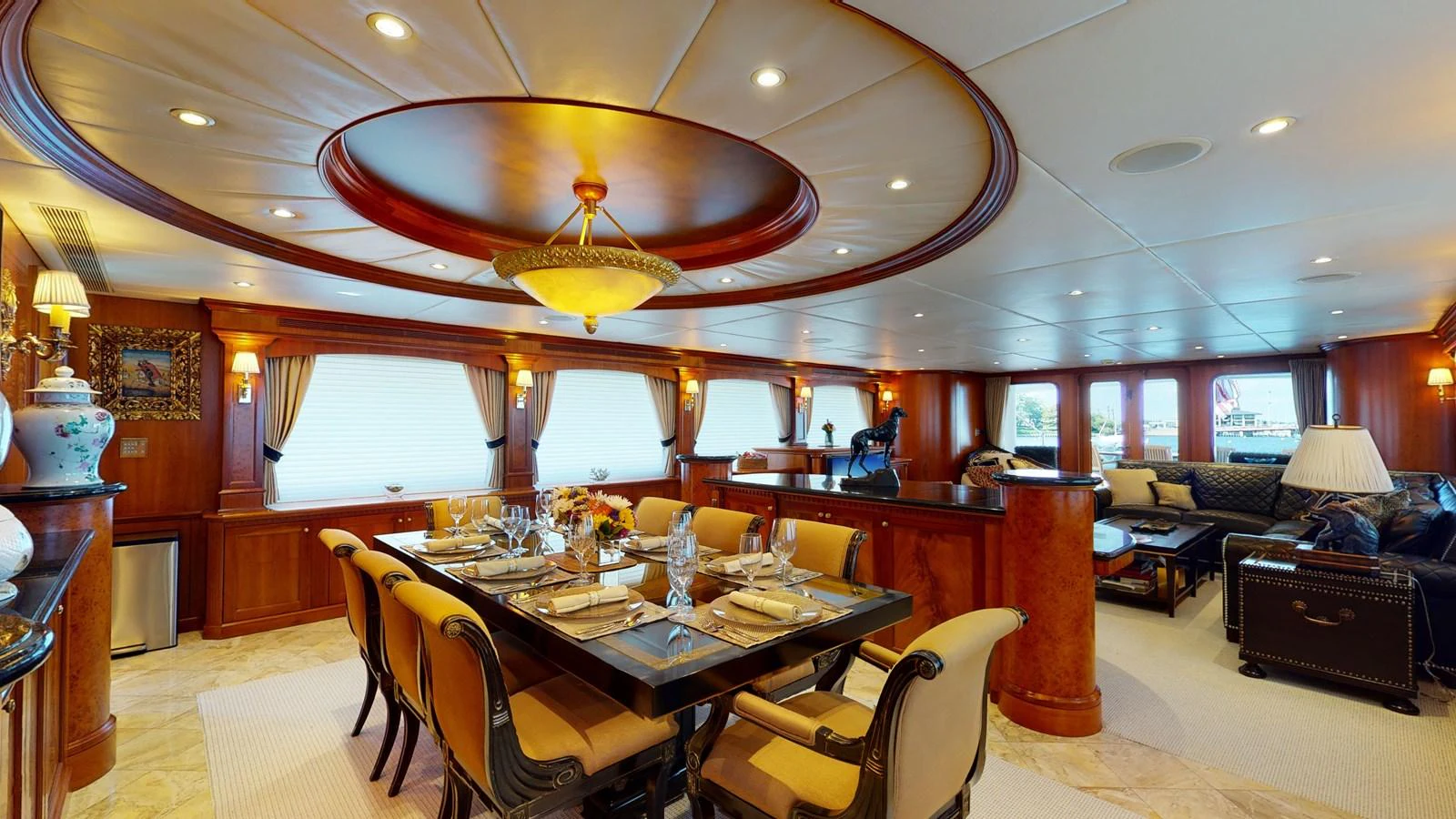 a large dining room with a chandelier aboard SUMMER LOVE Yacht for Sale
