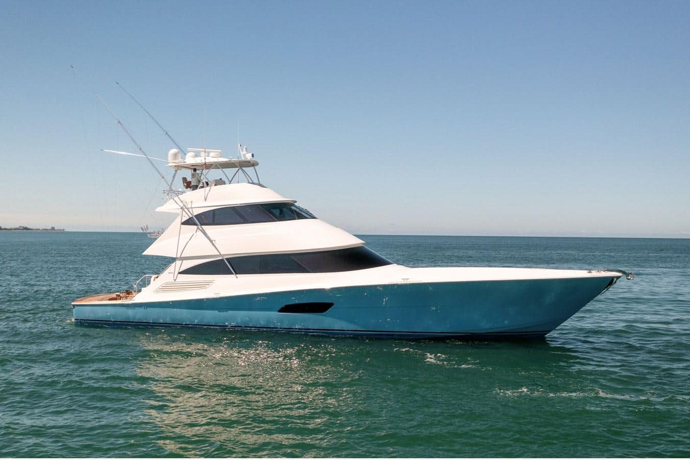 a white yacht in the water aboard ANOTHER DAY IN PARADISE Yacht for Sale