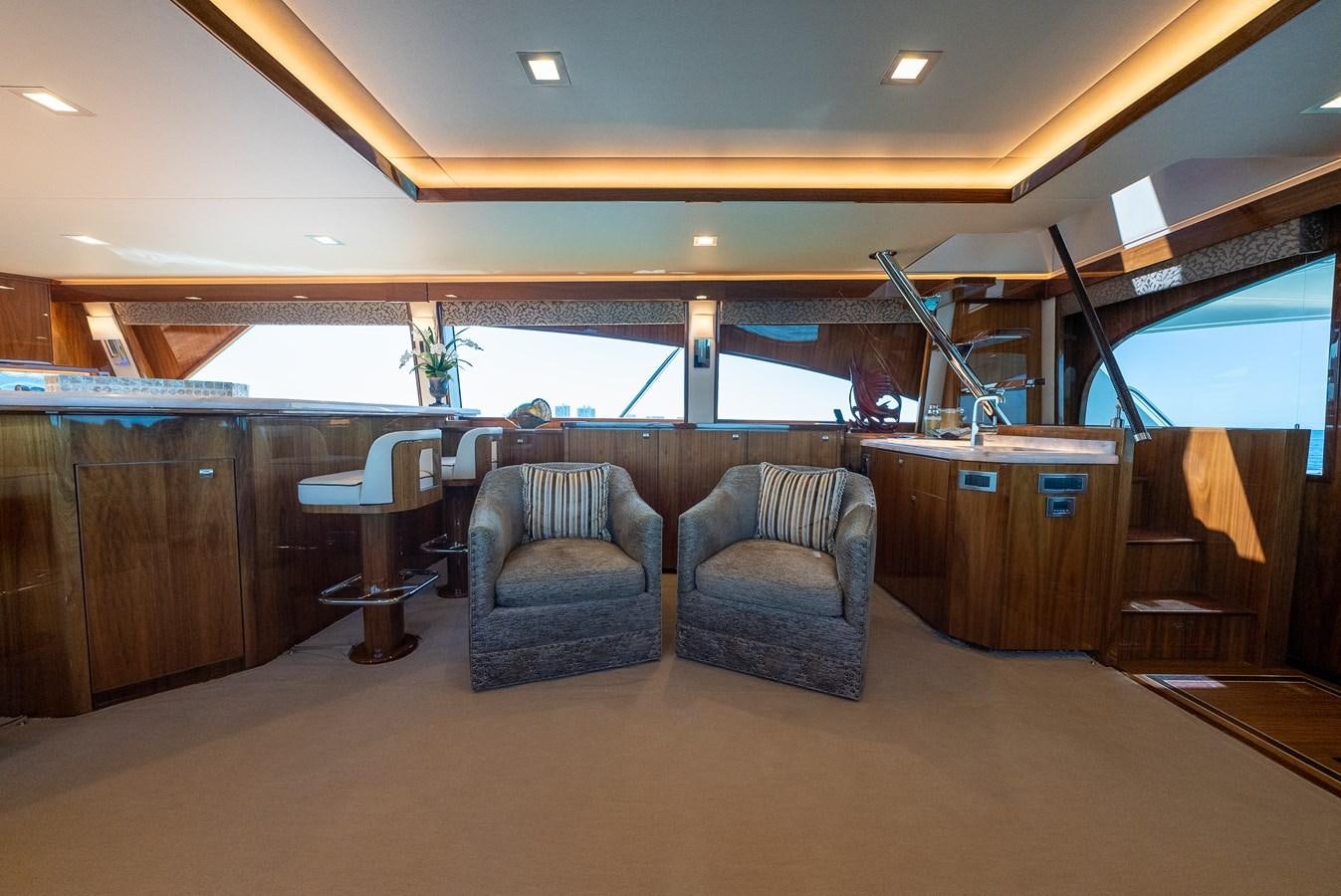 a room with chairs and a table aboard ANOTHER DAY IN PARADISE Yacht for Sale