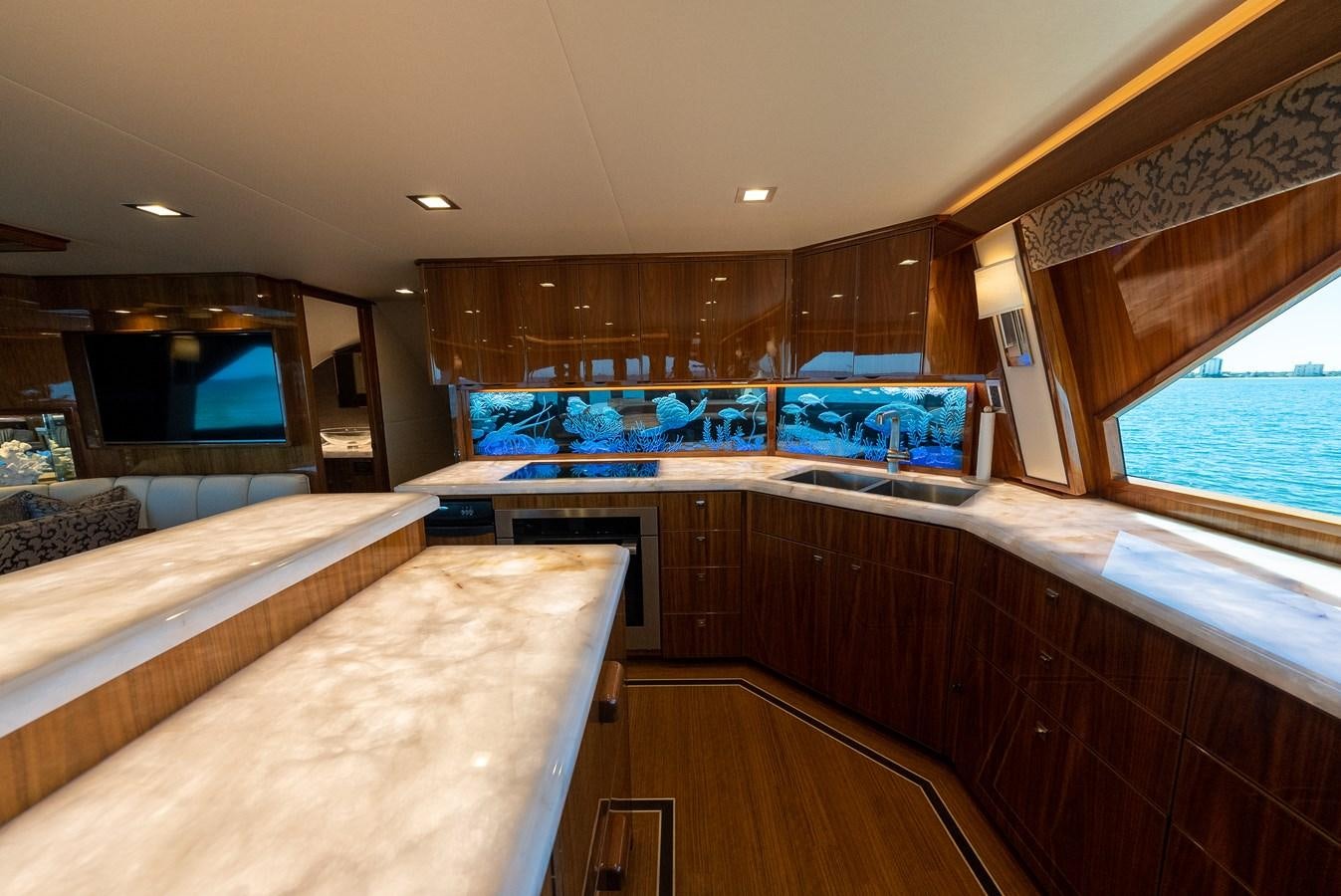 a room with a bed and a television aboard ANOTHER DAY IN PARADISE Yacht for Sale