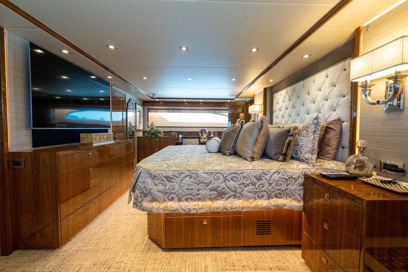 a bedroom with a large bed aboard ANOTHER DAY IN PARADISE Yacht for Sale
