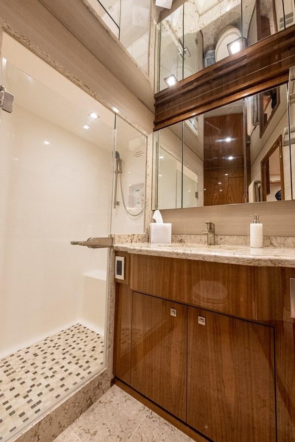 a bathroom with a large mirror aboard ANOTHER DAY IN PARADISE Yacht for Sale