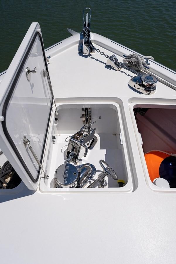 a boat with a steering wheel aboard ANOTHER DAY IN PARADISE Yacht for Sale