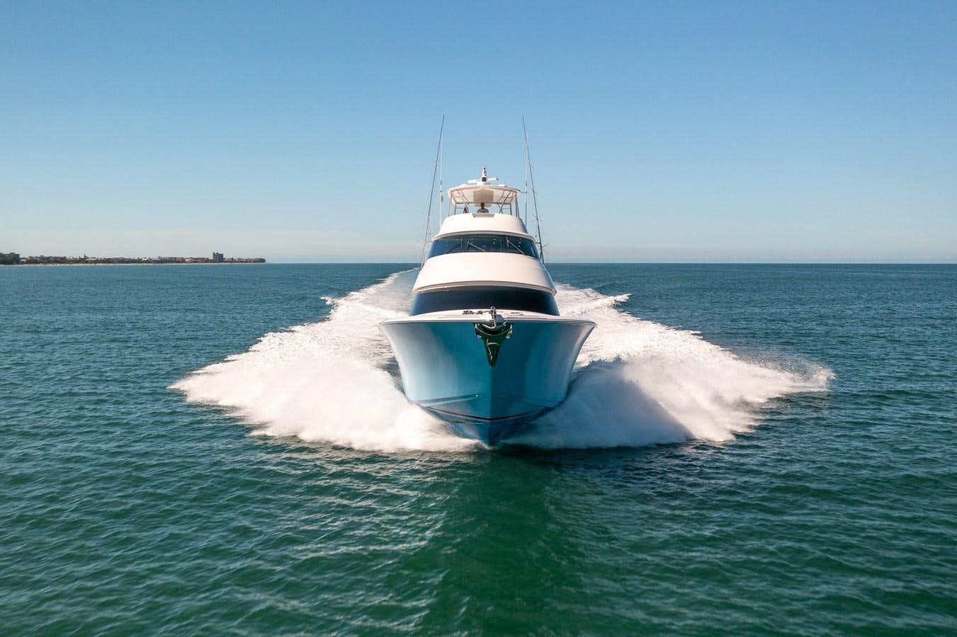 a white boat on the water aboard ANOTHER DAY IN PARADISE Yacht for Sale