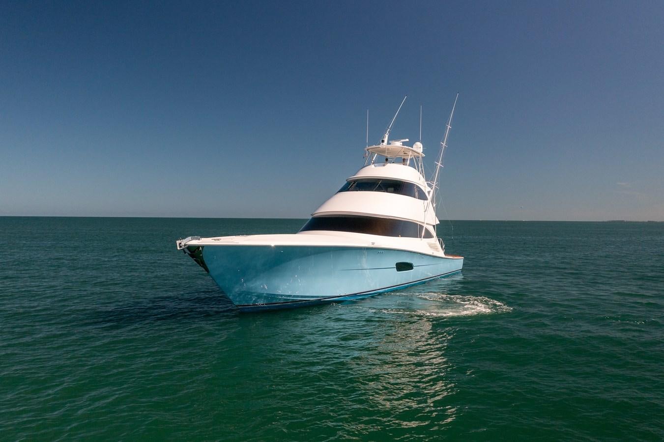 a white boat in the water aboard ANOTHER DAY IN PARADISE Yacht for Sale