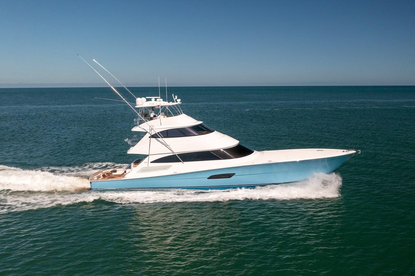 a white boat in the water aboard ANOTHER DAY IN PARADISE Yacht for Sale