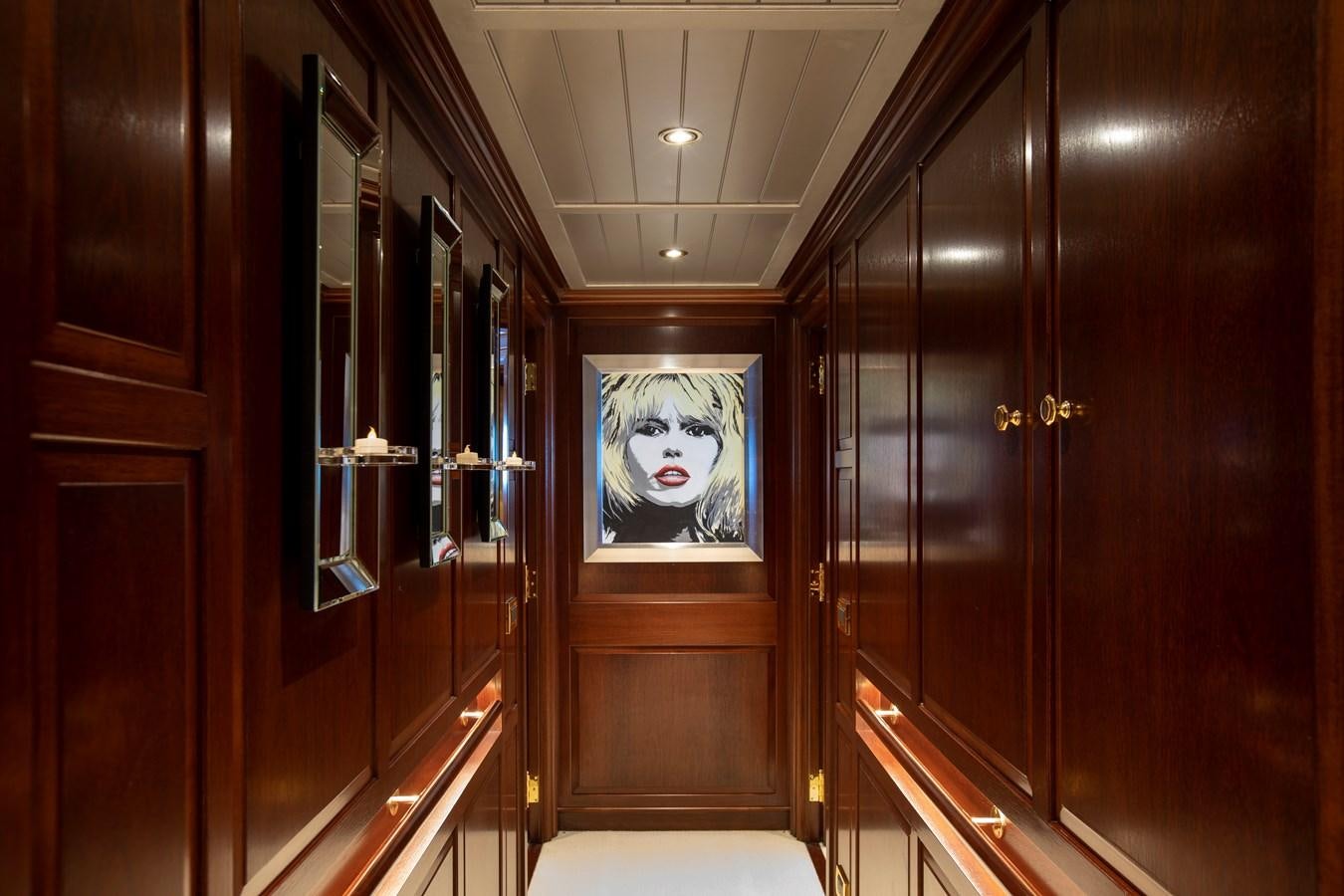 a room with wooden cabinets aboard MARE NOSTRUM Yacht for Charter