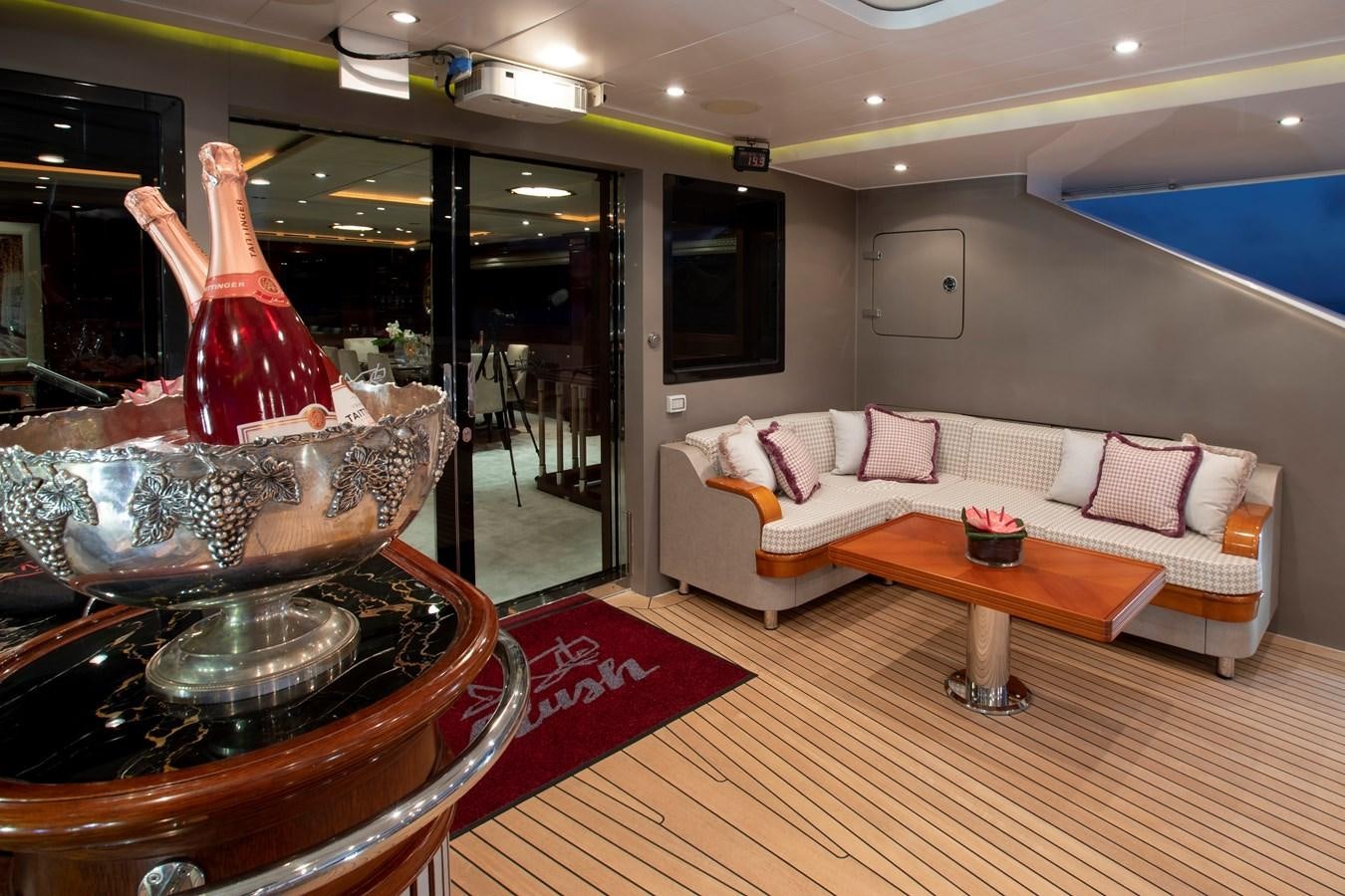 a living room with a large mirror aboard MARE NOSTRUM Yacht for Charter