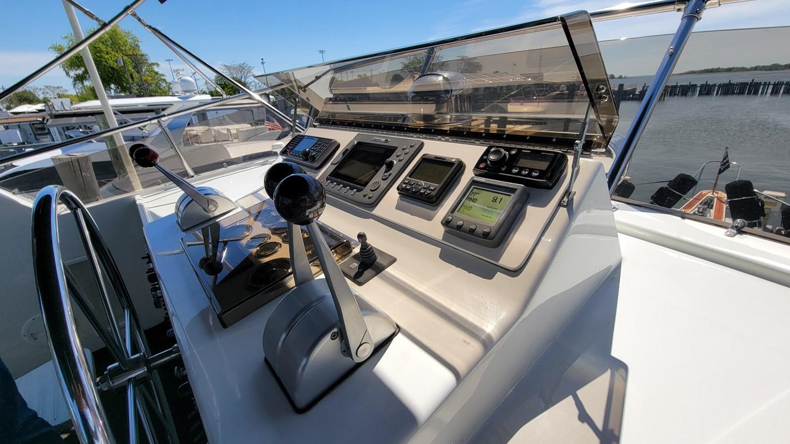 a boat with a steering wheel aboard LADY PATRICIA Yacht for Sale