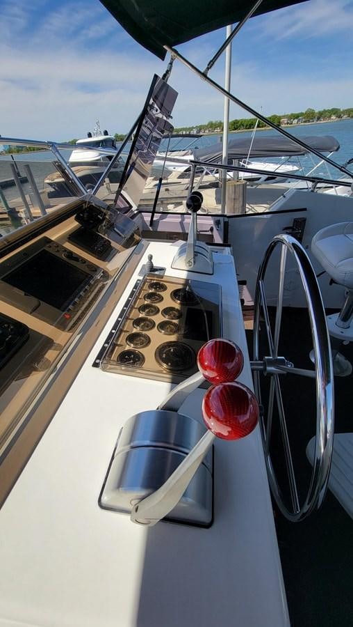a boat with a keyboard and a red ball on the front aboard LADY PATRICIA Yacht for Sale