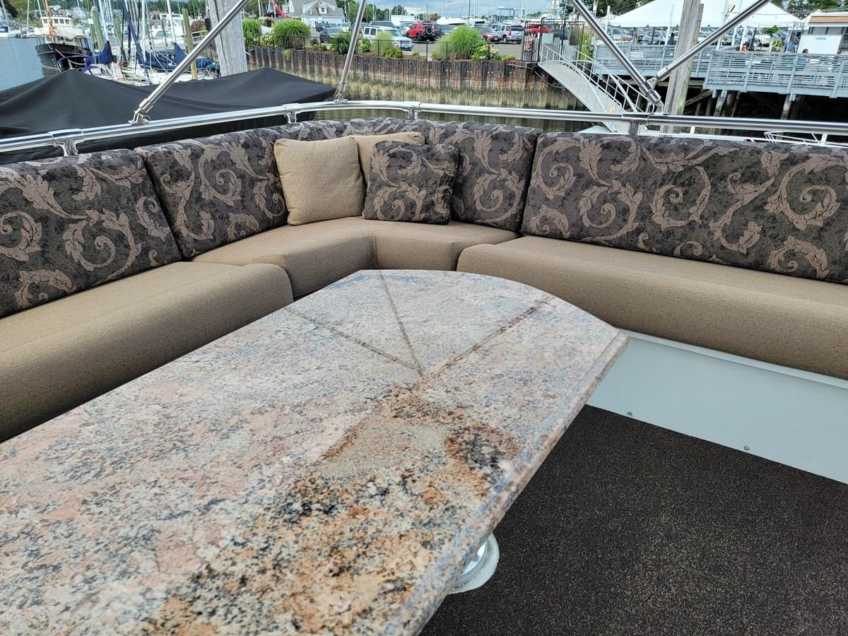 a concrete wall with a metal railing aboard LADY PATRICIA Yacht for Sale