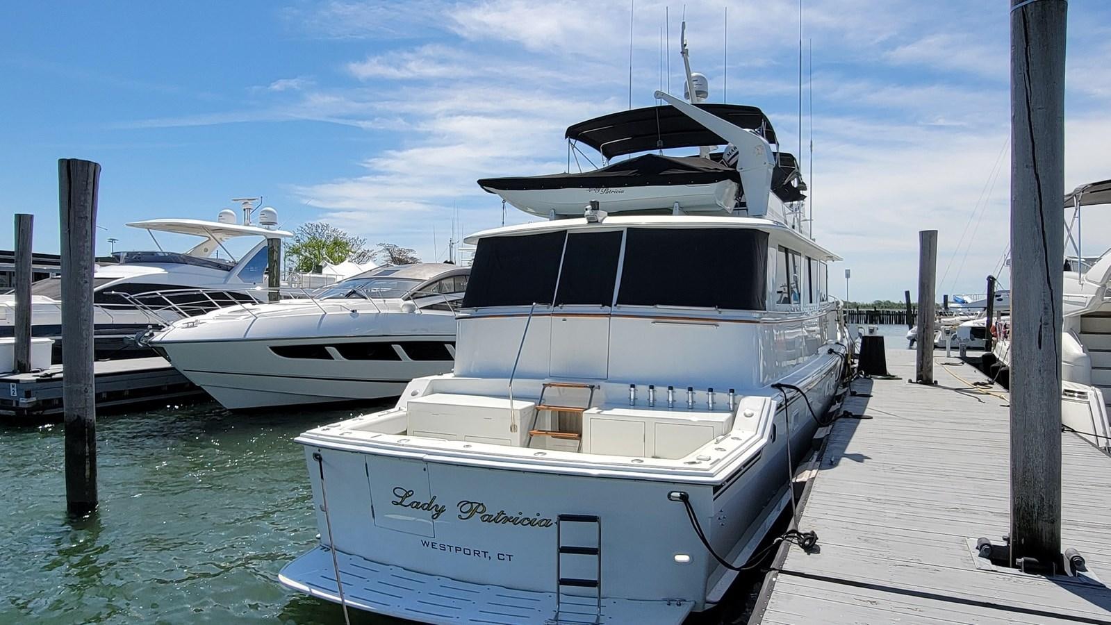 a couple of boats are parked at a dock aboard LADY PATRICIA Yacht for Sale