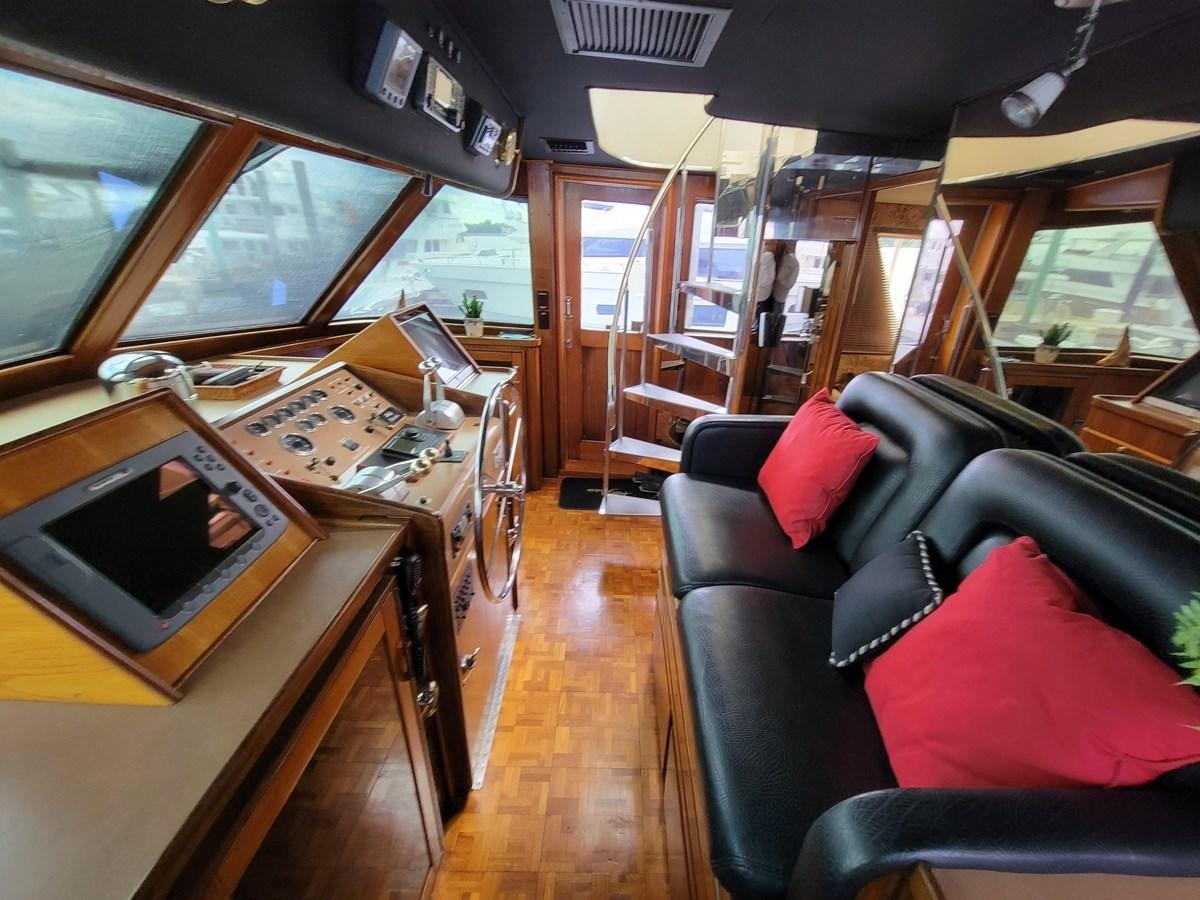 a room with a piano and a couch aboard LADY PATRICIA Yacht for Sale