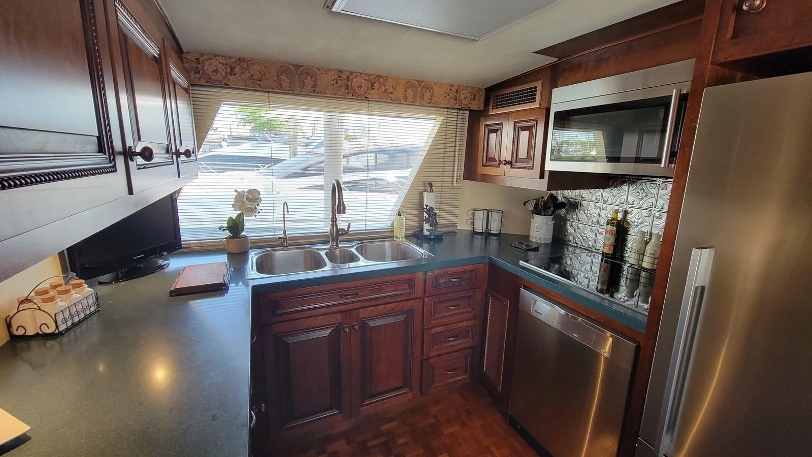 a kitchen with a large window aboard LADY PATRICIA Yacht for Sale
