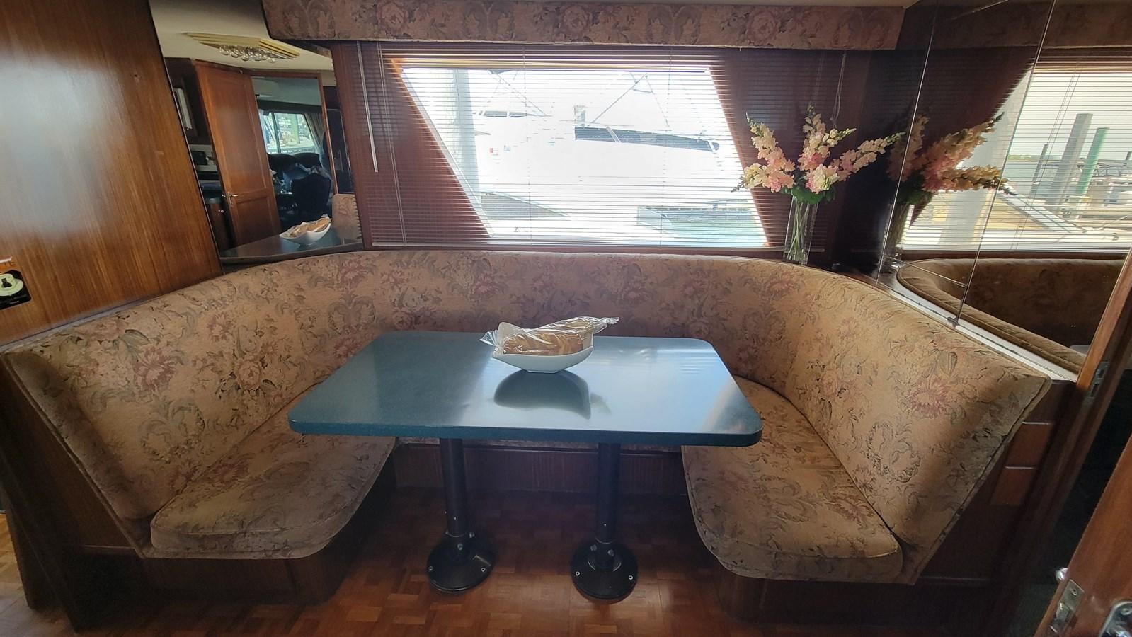 a table with a plate of food on it aboard LADY PATRICIA Yacht for Sale