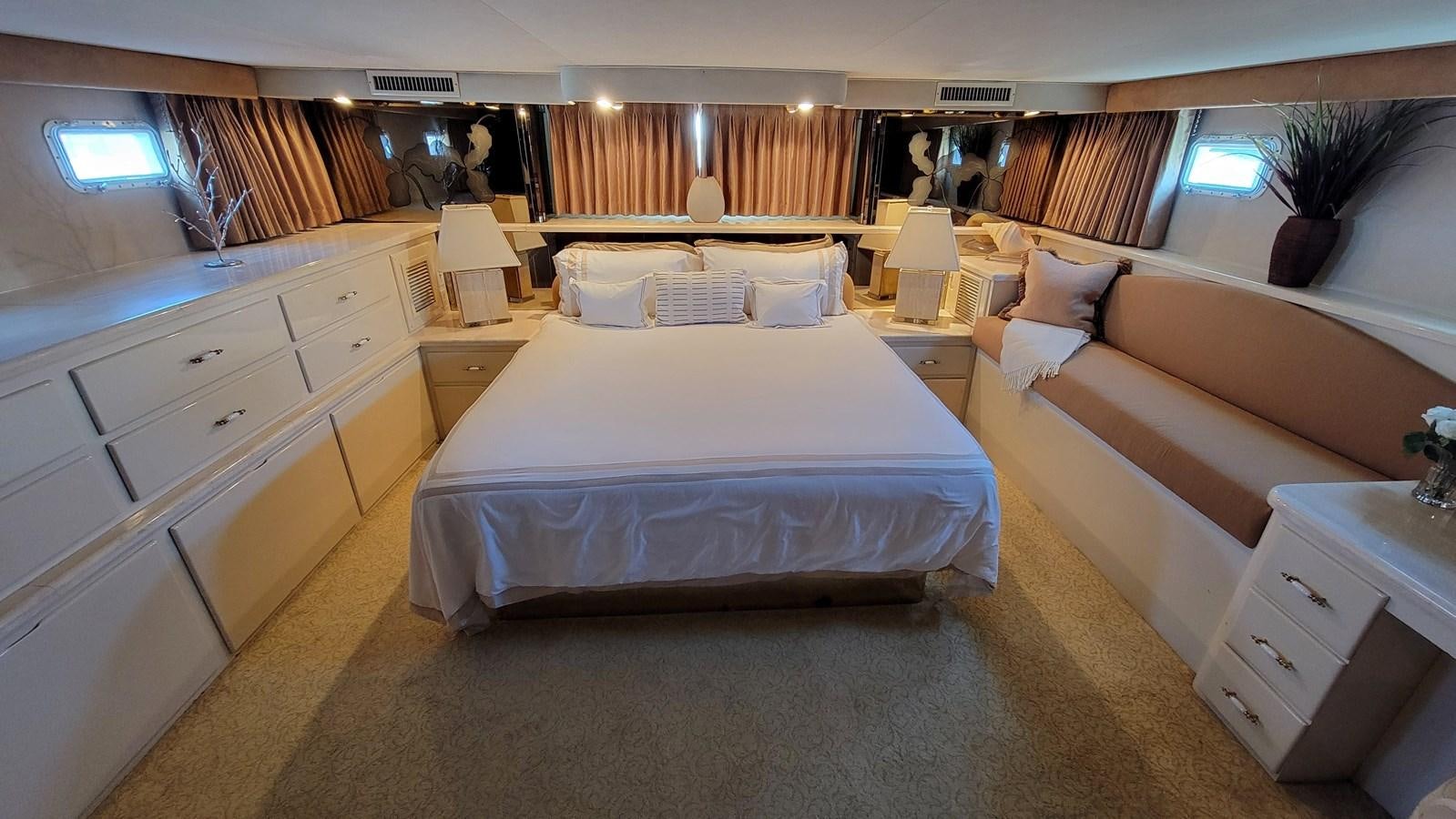 a room with a bed and a couch aboard LADY PATRICIA Yacht for Sale