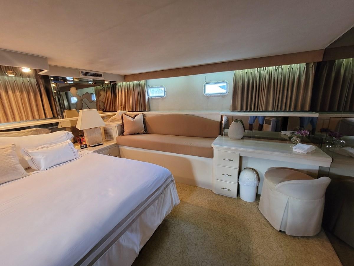 a room with a bed and a couch aboard LADY PATRICIA Yacht for Sale