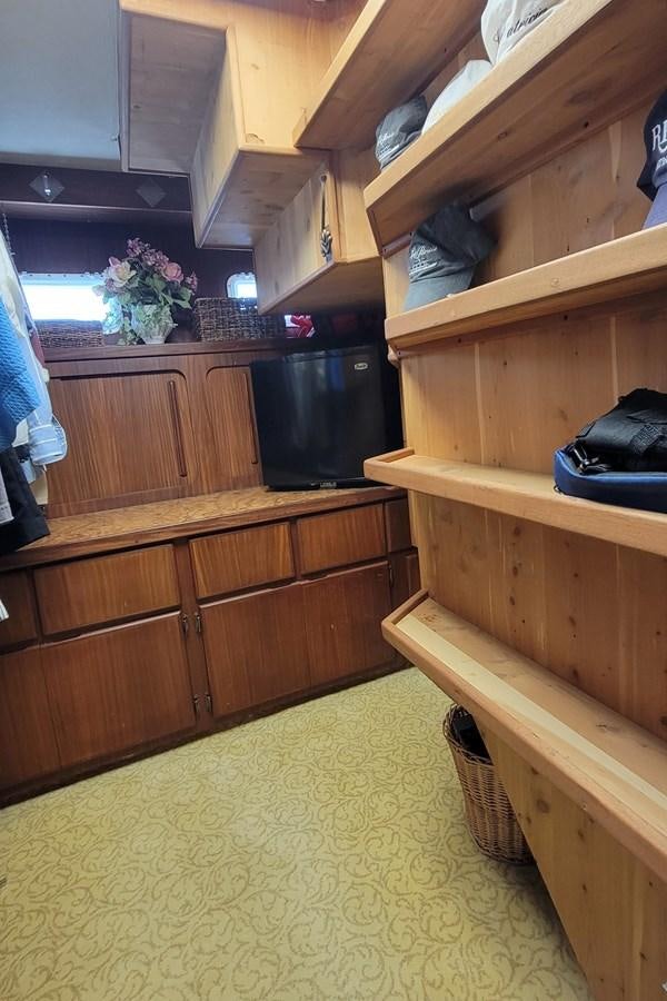 a kitchen with wooden cabinets aboard LADY PATRICIA Yacht for Sale