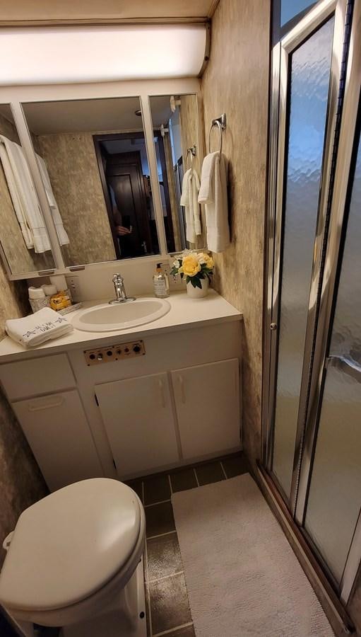 a bathroom with a sink and toilet aboard LADY PATRICIA Yacht for Sale