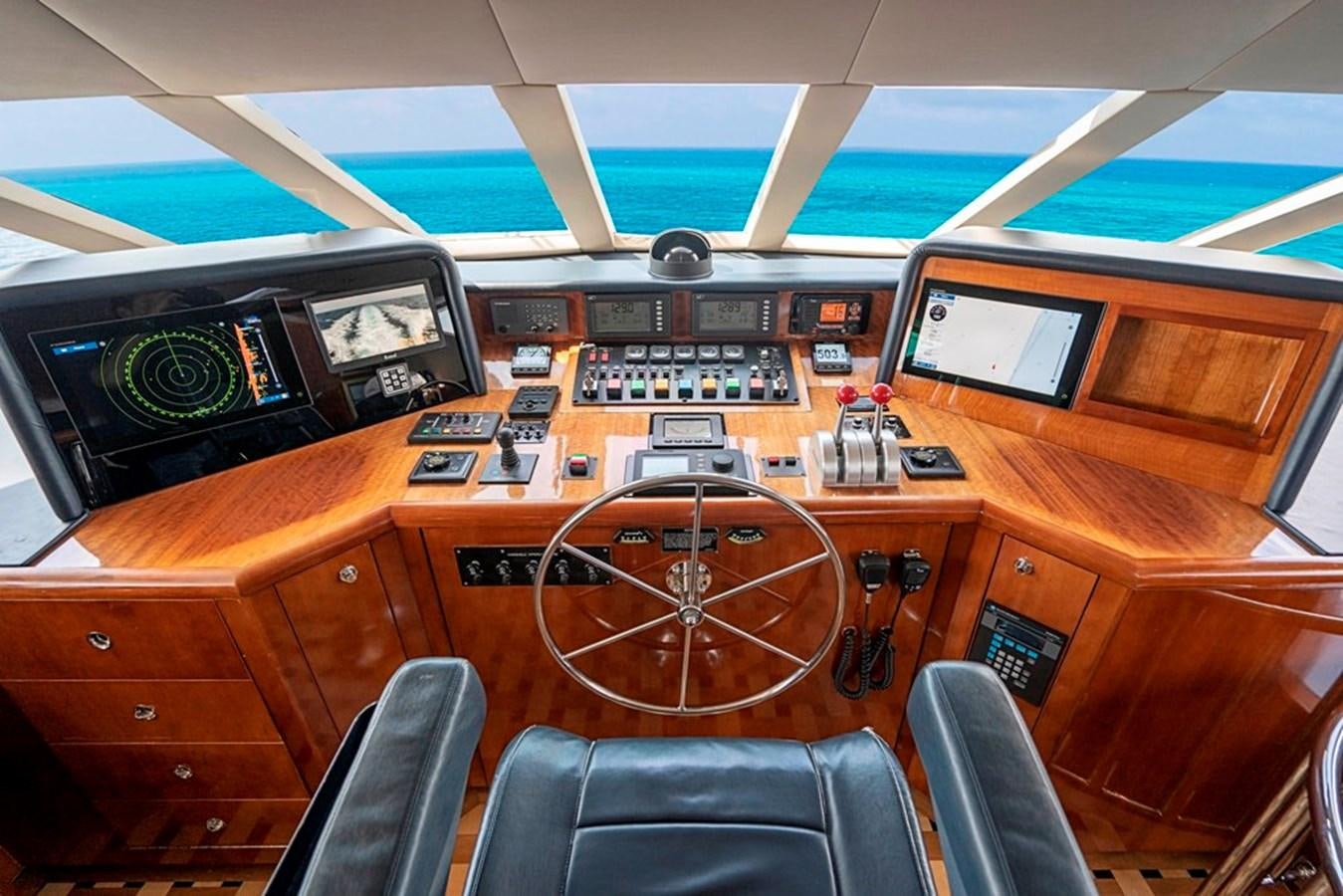 a control room with a few machines aboard PURA VIDA Yacht for Sale