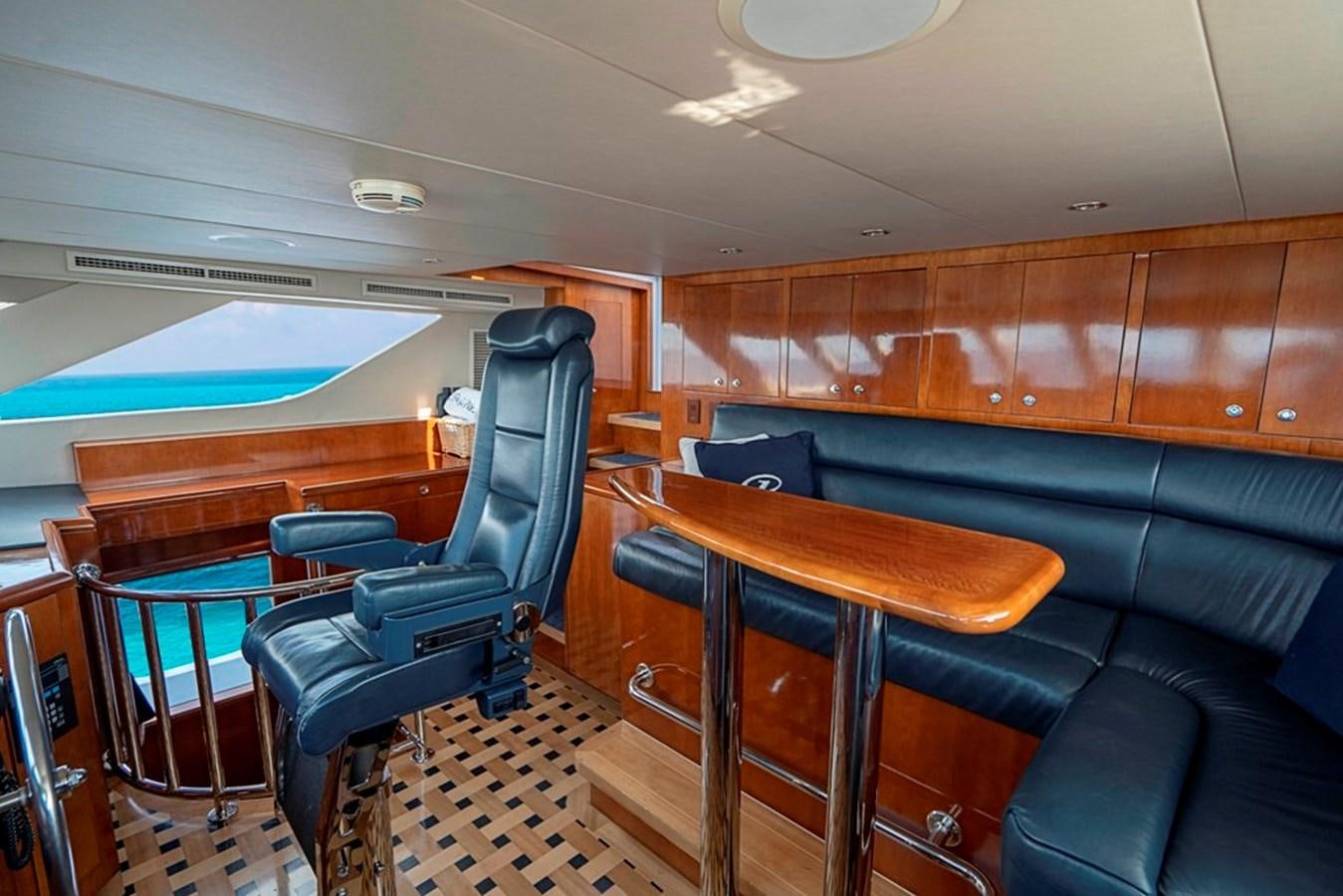 a room with a couch and a pool table aboard PURA VIDA Yacht for Sale