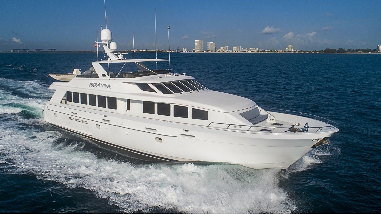 a white yacht on the water aboard PURA VIDA Yacht for Sale