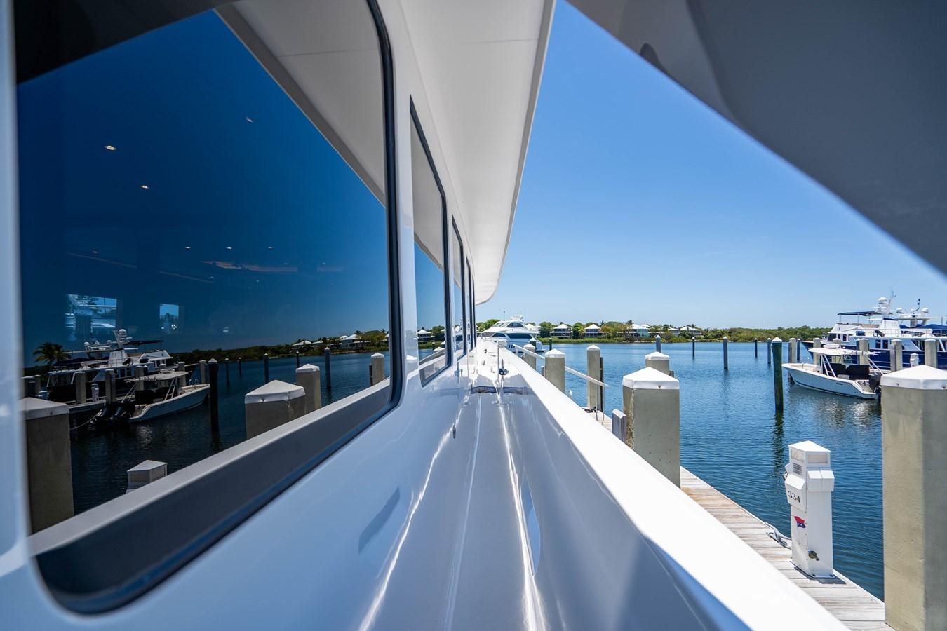 a large white boat on a large body of water aboard PURA VIDA Yacht for Sale