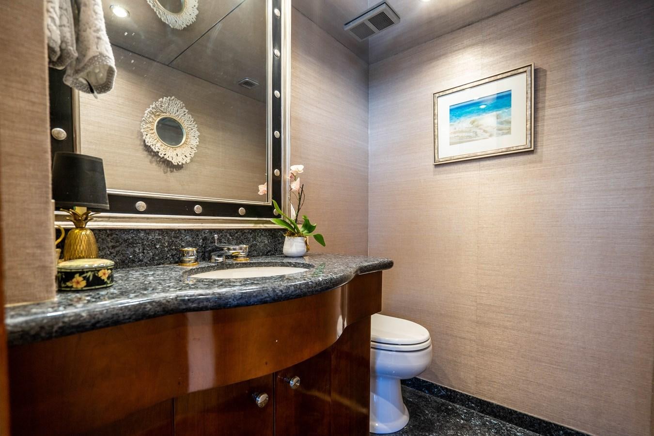 a bathroom with a large mirror aboard PURA VIDA Yacht for Sale