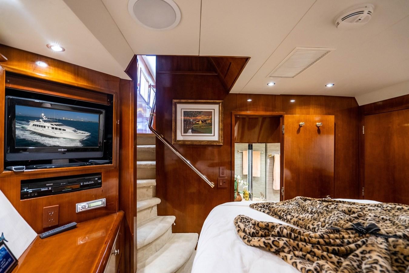 a tv on a stand in a room aboard PURA VIDA Yacht for Sale