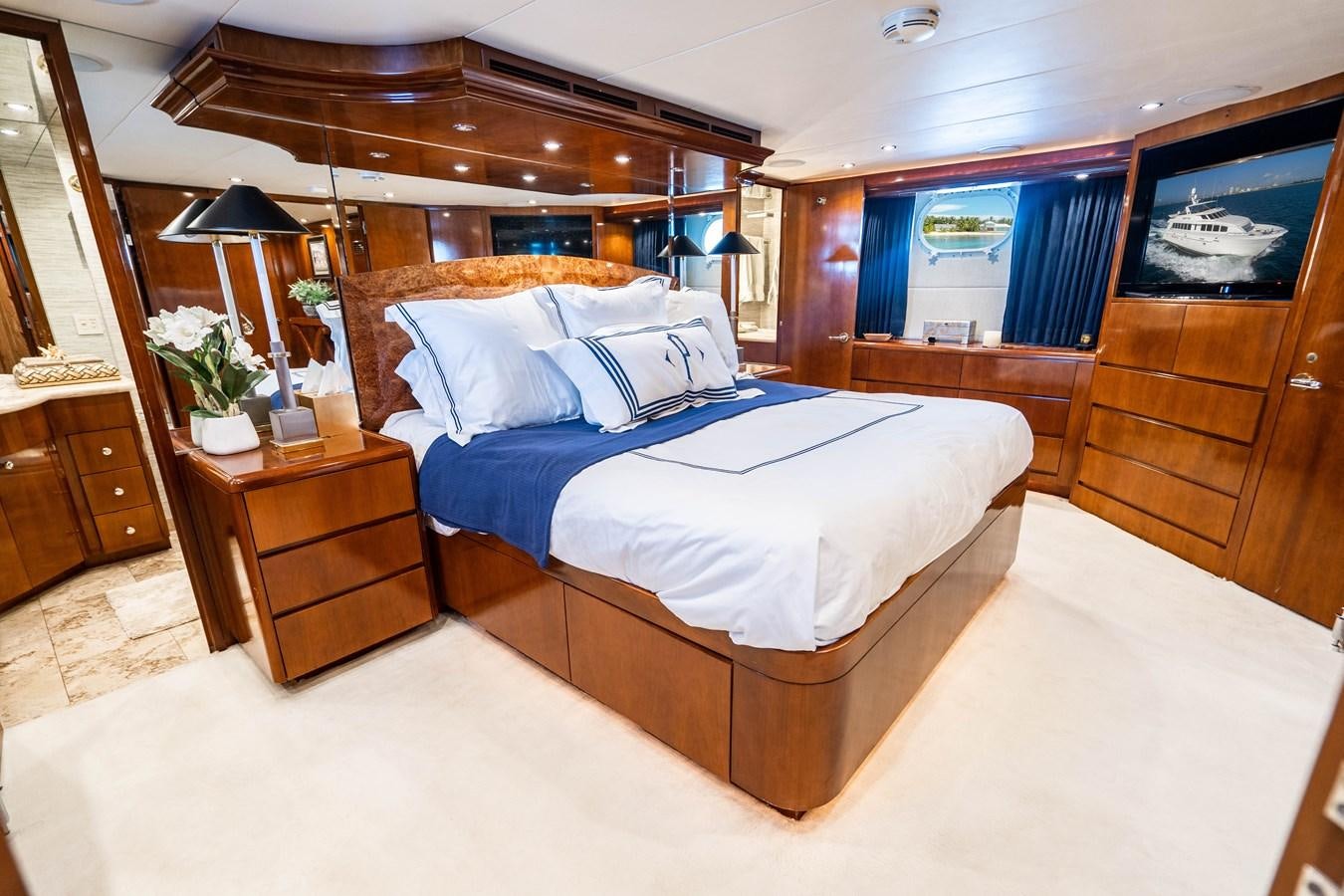 a bed in a room aboard PURA VIDA Yacht for Sale