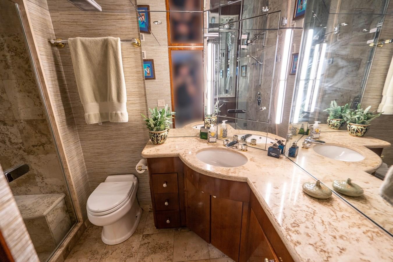 a bathroom with a large mirror aboard PURA VIDA Yacht for Sale
