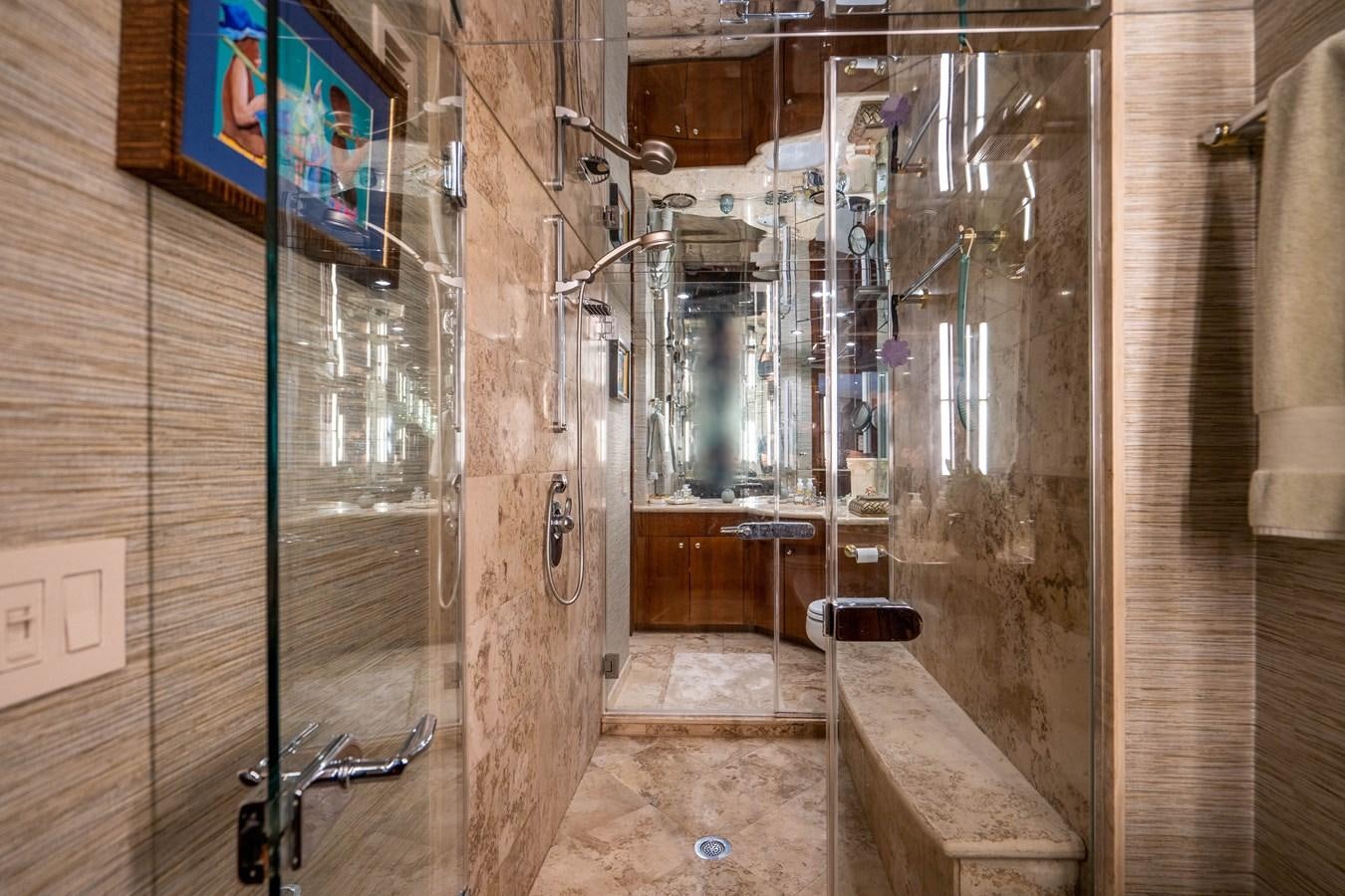a room with a shower and a sink aboard PURA VIDA Yacht for Sale