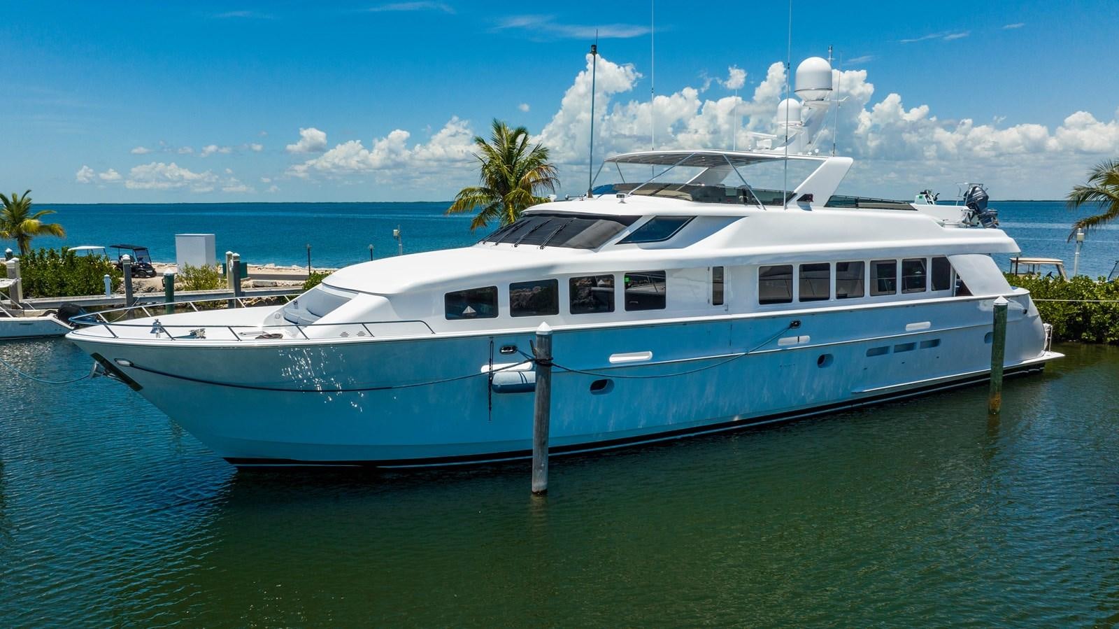 a large white boat in the water aboard PURA VIDA Yacht for Sale