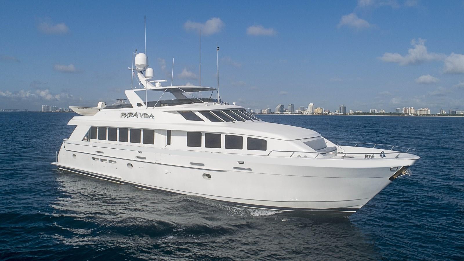 a white yacht in the water aboard PURA VIDA Yacht for Sale