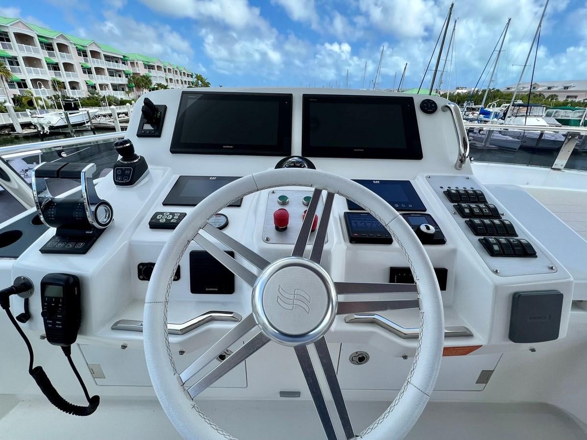 a white car with a steering wheel aboard SIRENA 64 FLYBRIDGE Yacht for Sale