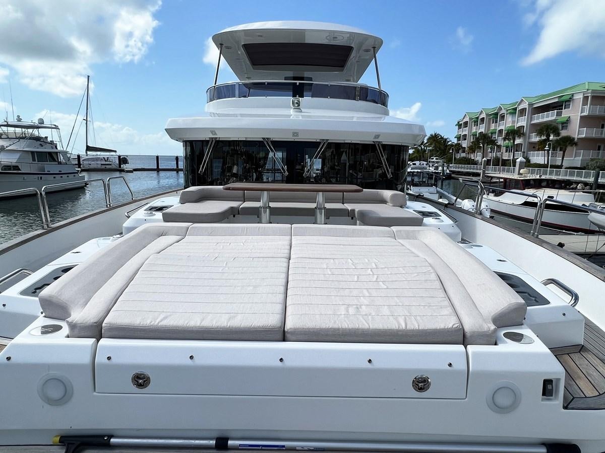 a large cruise ship docked aboard SIRENA 64 FLYBRIDGE Yacht for Sale