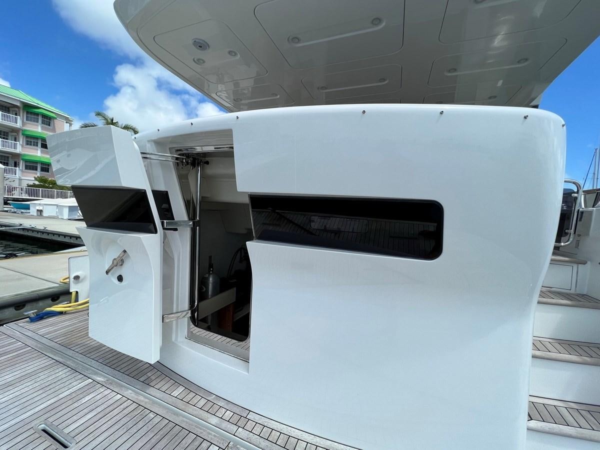 a white rectangular object with a black object on it aboard SIRENA 64 FLYBRIDGE Yacht for Sale