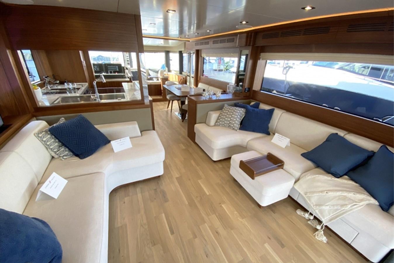 a room with a bed and a large window aboard SIRENA 64 FLYBRIDGE Yacht for Sale